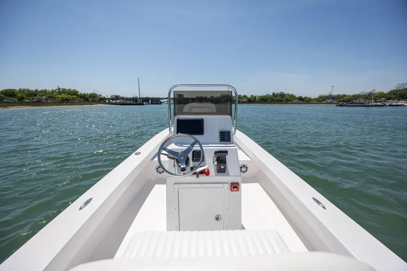 Slide: The Image of StroudCraft 2000 boat, 2026 model, cruising on a sunny day in calm waters. - 11