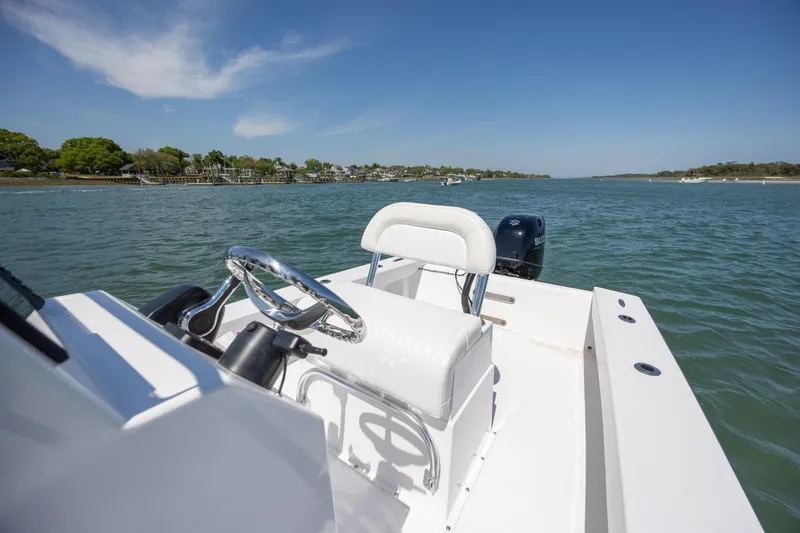 Slide: The Image of StroudCraft 2000 boat cruising on a scenic waterway, 2026 model. - 13