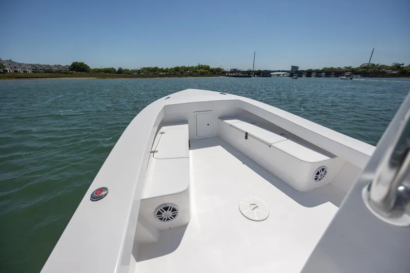 Slide: The Image of StroudCraft 2000 boat, 2026 model, cruising on a sunny day in calm waters. - 14