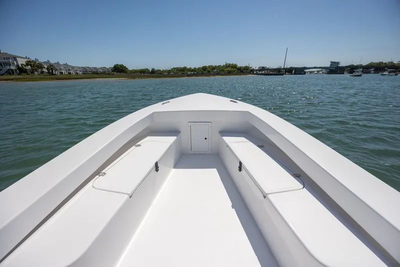 Slide: The Image of StroudCraft 2000 boat, 2026 model, cruising on a sunny day in calm waters. - 15