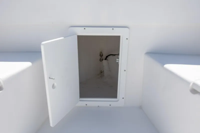 Slide: The Image of Open storage compartment on a 2026 StroudCraft 2000 boat, showcasing interior space. - 19