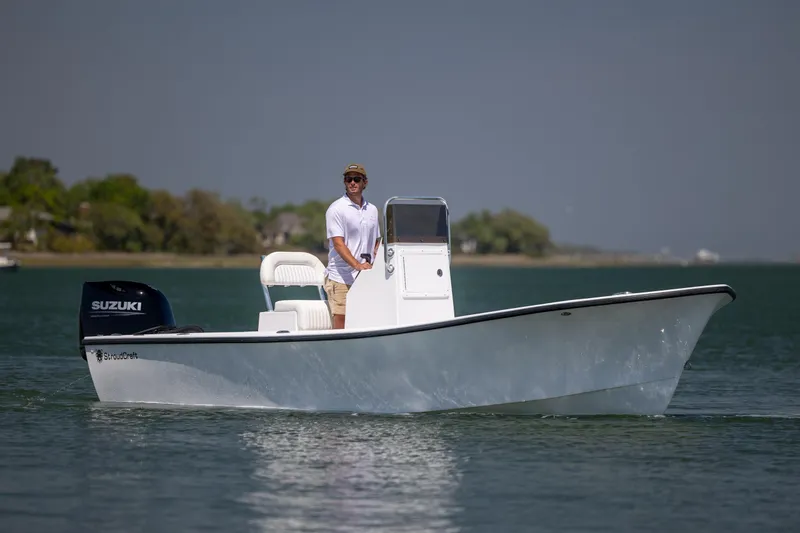 Slide: The Image of 2026 StroudCraft 2000 boat with Suzuki engine on calm water. - 5