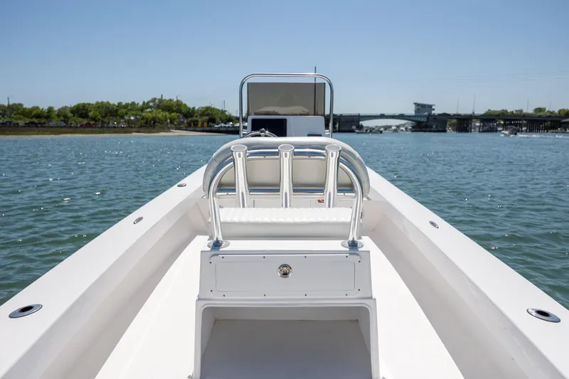 Slide: The Image of StroudCraft 2000 boat on water, 2026 model, with clear sky and bridge in background. - 9