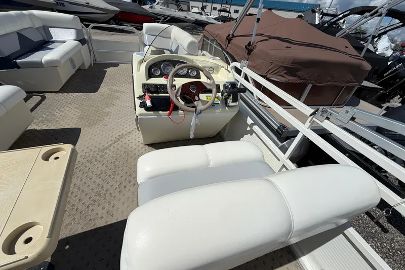 Slide: The Image of 2004 Bentley Pontoons 200 CRUISE interior with steering console and seating. - 14