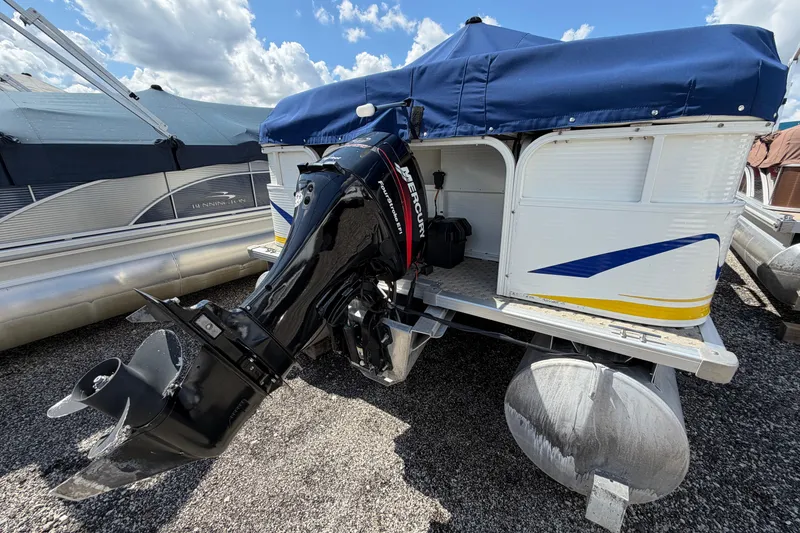 Slide: The Image of 2004 Bentley Pontoons 200 CRUISE with Mercury outboard motor, docked under blue sky. - 7