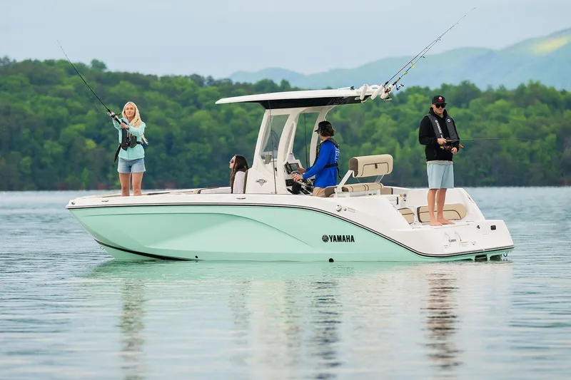 Slide: The Image of Manufacturer Provided Image: 2026 Yamaha Boats 222 FSH Sport E on a serene lake, people fishing. - 12