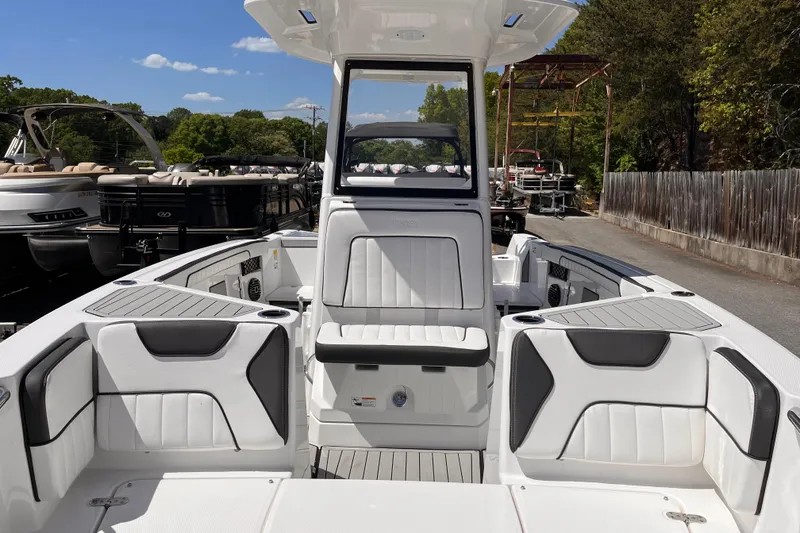 Slide: The Image of 2026 Yamaha Boats 222 FSH Sport E interior with white seating and sleek design. - 5