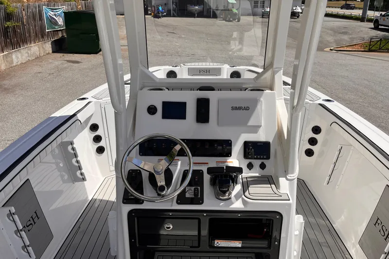 Slide: The Image of 2026 Yamaha Boats 222 FSH Sport E dashboard with steering wheel and controls. - 6