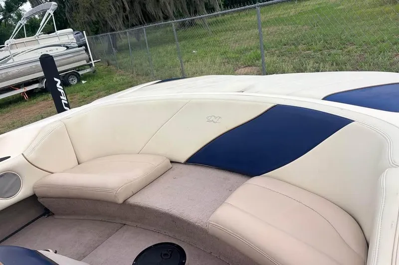 Slide: The Image of 2001 Nautique Sport Nautique 200 boat interior with beige and blue seating. - 4