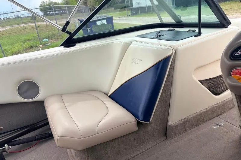 Slide: The Image of 2001 Nautique Sport Nautique 200 interior with beige and blue seating. - 6