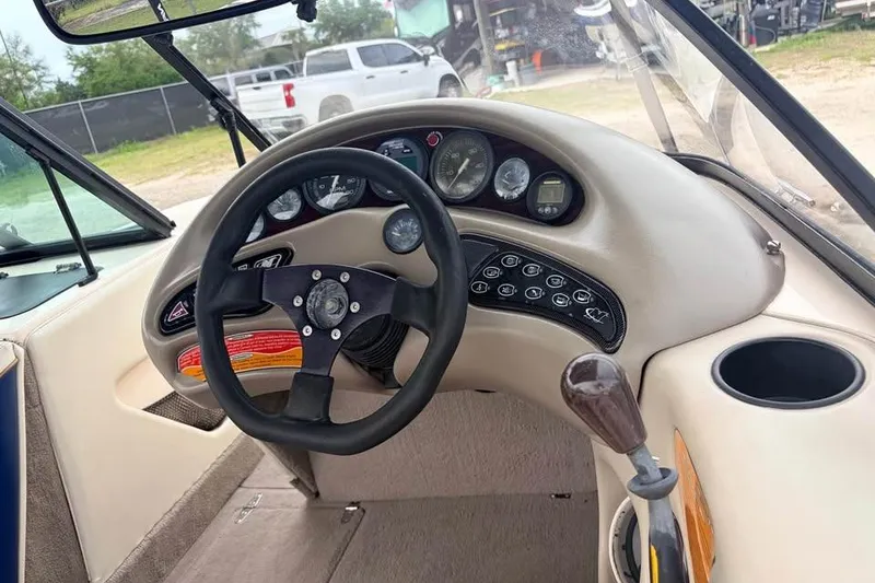Slide: The Image of 2001 Nautique Sport Nautique 200 dashboard with steering wheel and control panel. - 7