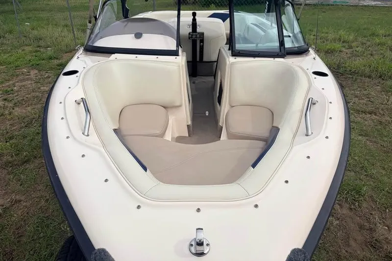 Slide: The Image of 2001 Nautique Sport Nautique 200 boat interior with beige seating and windshield. - 8