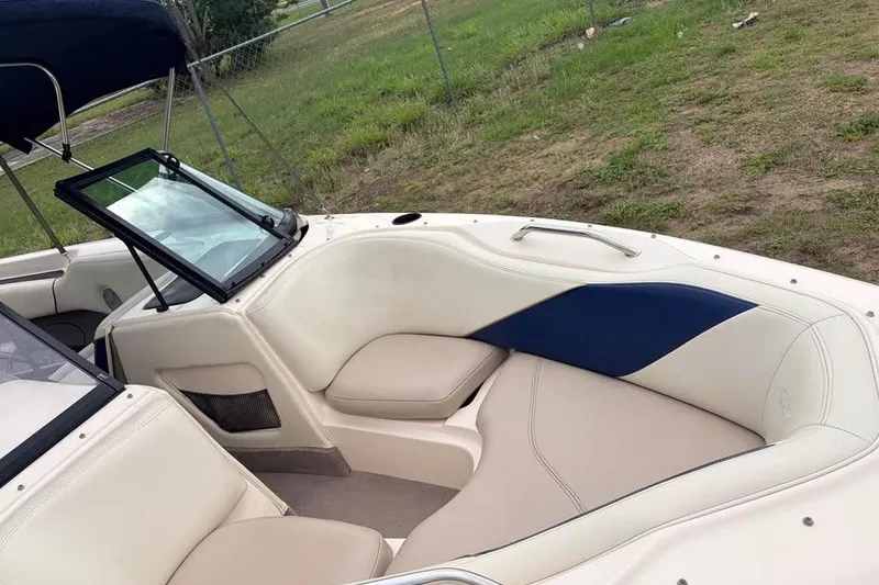 Slide: The Image of 2001 Nautique Sport Nautique 200 boat interior with beige and blue seating. - 9