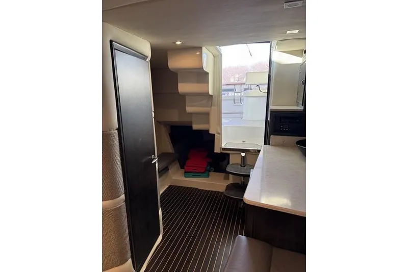 Slide: The Image of Interior of 2016 Cobalt A40 boat with modern design and compact layout. - 13