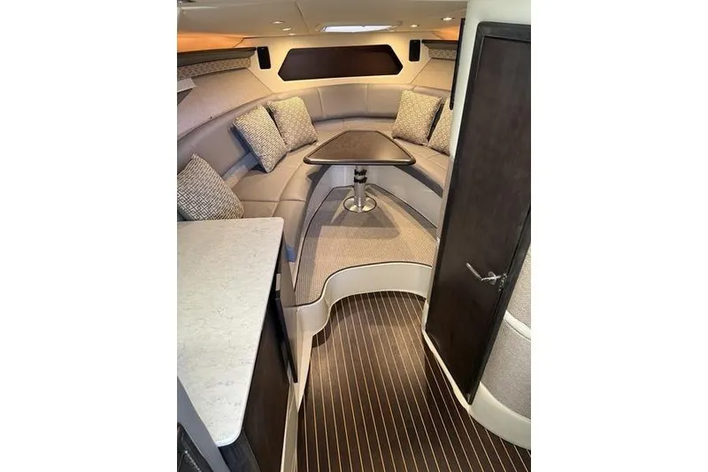 Slide: The Image of Luxurious interior of a 2016 Cobalt A40 boat with elegant seating and table. - 14