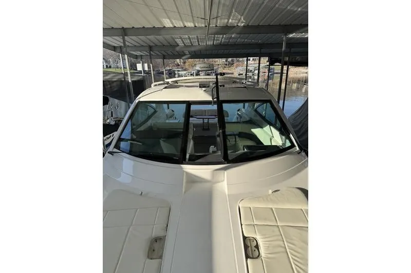 Slide: The Image of 2016 Cobalt A40 boat docked under a covered marina. - 15