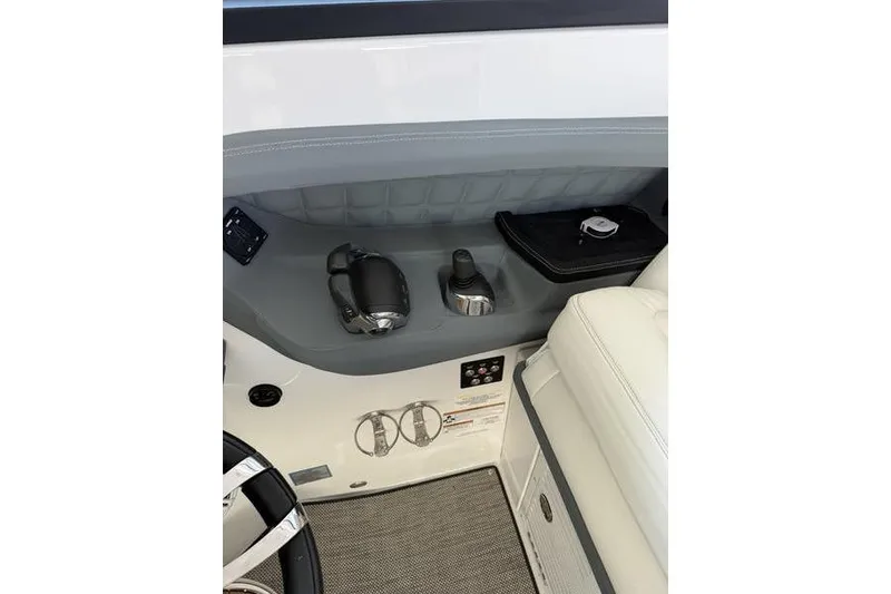 Slide: The Image of Interior of 2016 Cobalt A40 boat showing controls and seating area. - 18