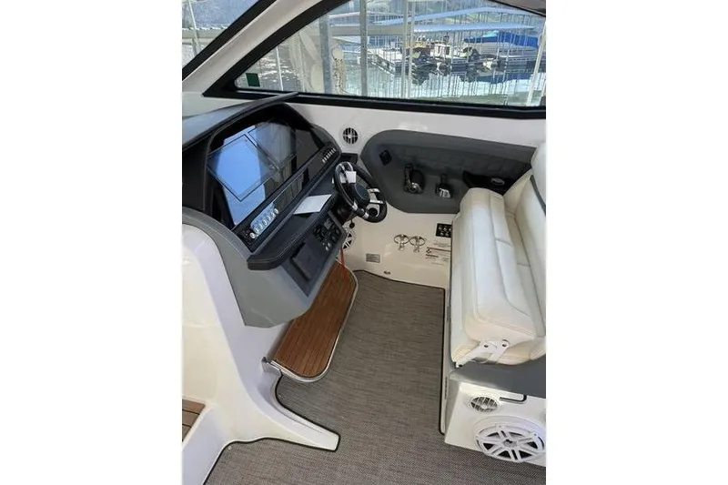 Slide: The Image of Interior of a 2016 Cobalt A40 boat with modern helm and seating. - 20