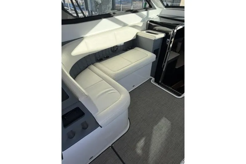 Slide: The Image of Interior of a 2016 Cobalt A40 boat with white leather seating. - 21