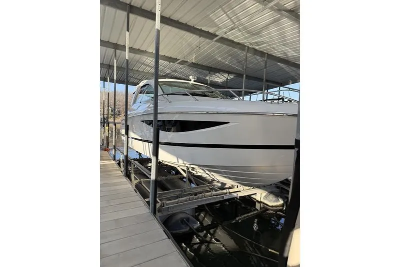 Slide: The Image of 2016 Cobalt A40 boat docked in a covered marina. - 6