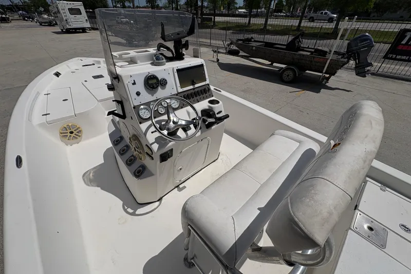 Slide: The Image of 2005 Blazer Bay 2220 Professional boat interior with steering console and seating. - 14