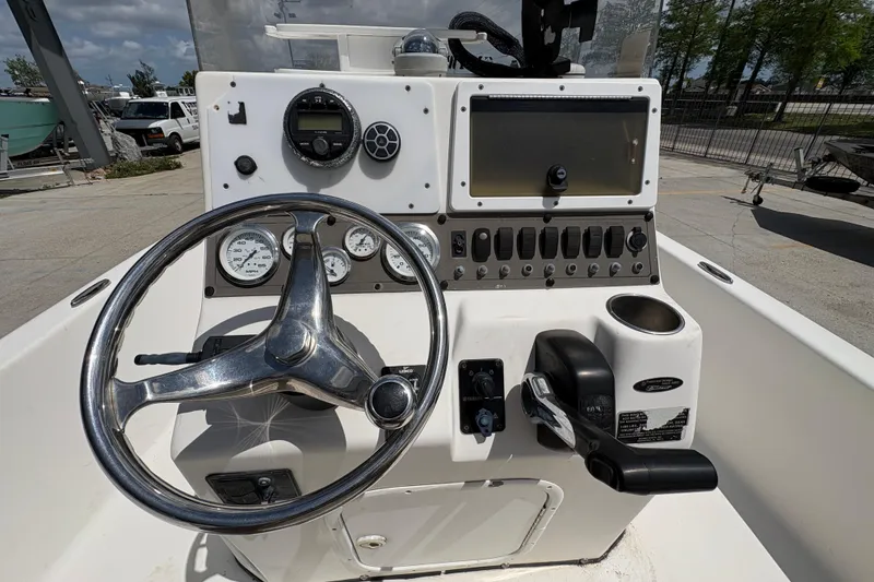Slide: The Image of 2005 Blazer Bay 2220 Professional boat console with steering wheel and control panel. - 17
