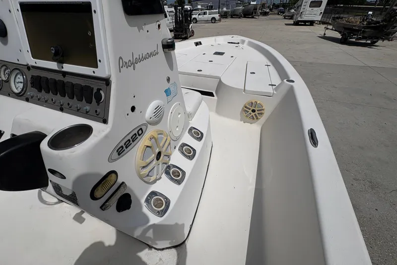 Slide: The Image of 2005 Blazer Bay 2220 Professional boat interior with control panel and seating area. - 20