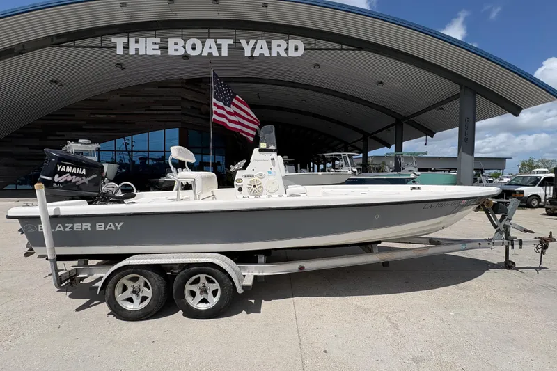 Slide: The Image of 2005 Blazer Bay 2220 Professional boat on trailer at The Boat Yard, featuring Yamaha engine. - 3