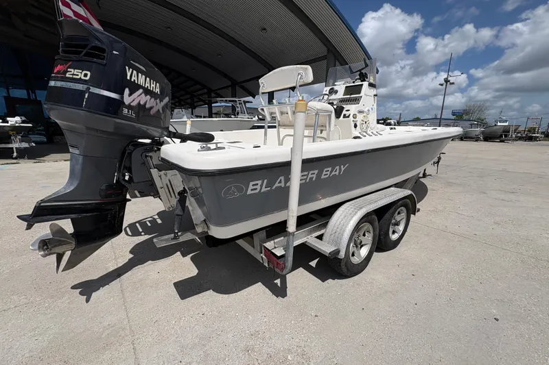 Slide: The Image of 2005 Blazer Bay 2220 Professional boat on trailer with Yamaha VMAX engine. - 4