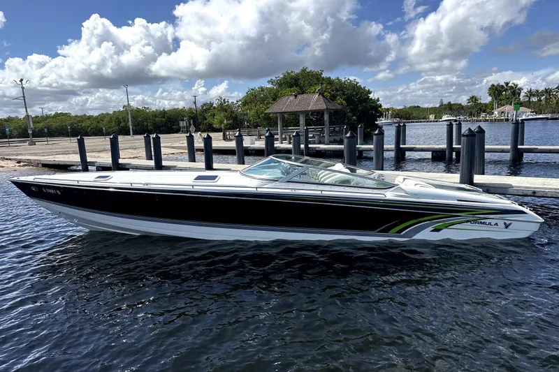 The Image of 2008 Formula 353 FASTech speedboat docked on a sunny day with cloudy sky. - 0