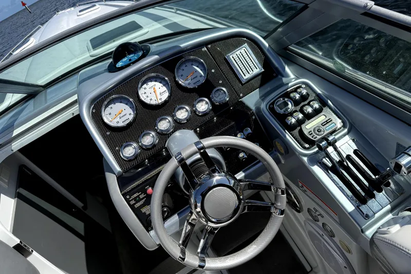 Slide: The Image of Cockpit of 2008 Formula 353 FASTech boat with sleek steering and control panel. - 10