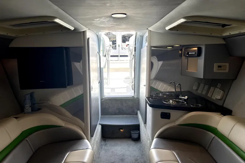 Slide: The Image of Interior of 2008 Formula 353 FASTech boat with seating, kitchenette, and entertainment system. - 11