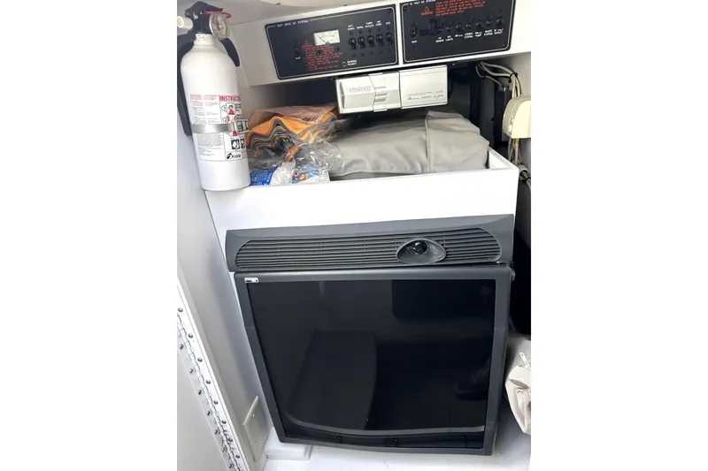 Slide: The Image of Interior of 2008 Formula 353 FASTech with fire extinguisher and control panel. - 12