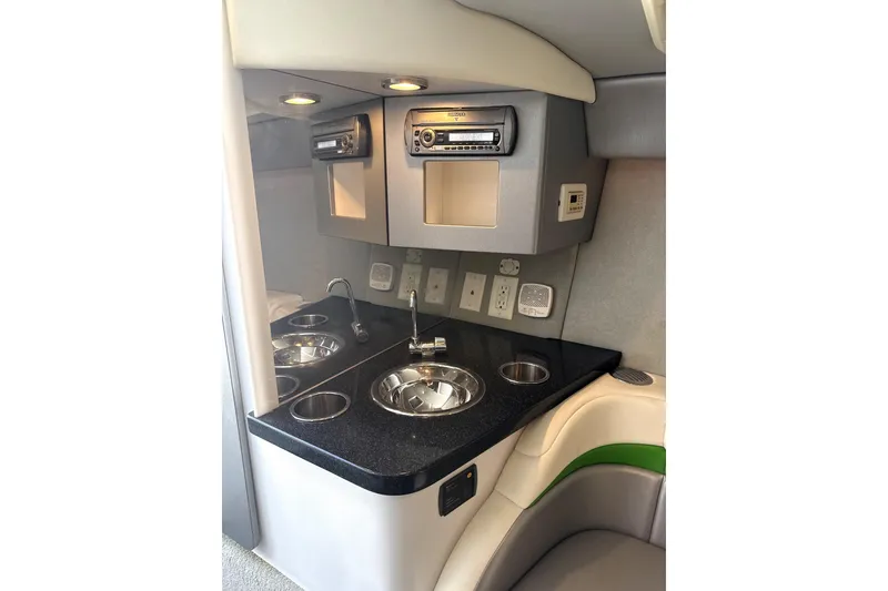 Slide: The Image of 2008 Formula 353 FASTech cabin interior with sink, stereo, and storage compartments. - 14