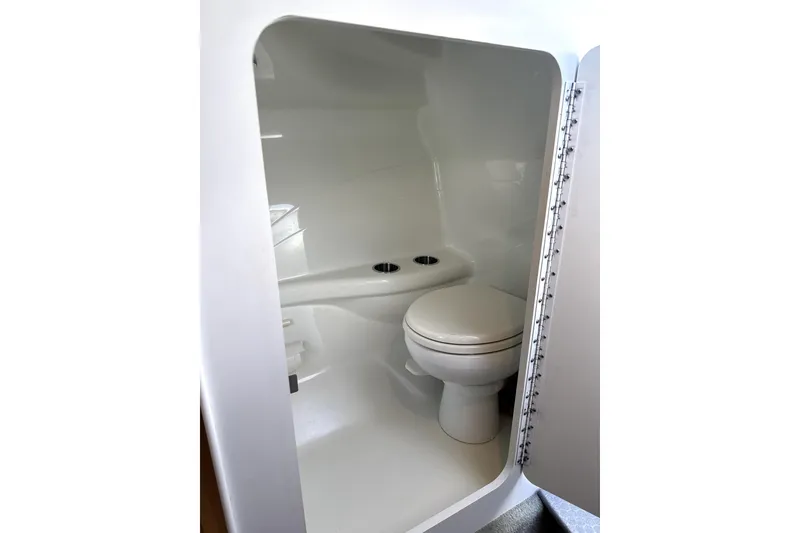 Slide: The Image of 2008 Formula 353 FASTech boat interior bathroom with toilet and sink. - 17