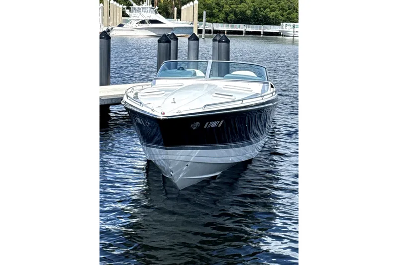 Slide: The Image of 2008 Formula 353 FASTech boat docked on calm water. - 2