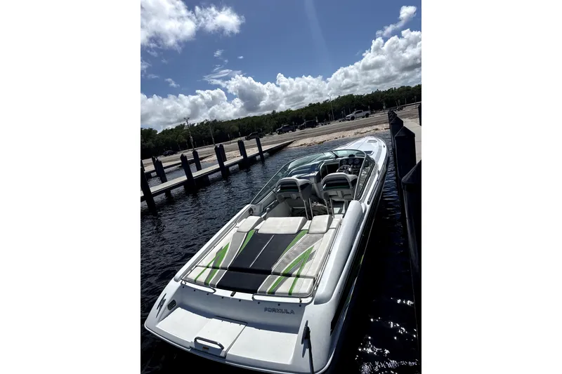 Slide: The Image of 2008 Formula 353 FASTech boat docked under a sunny sky. - 3