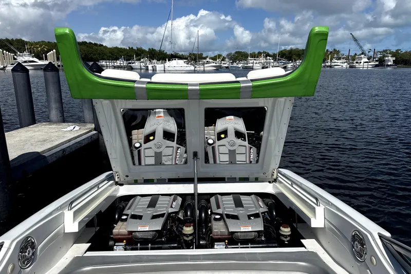 Slide: The Image of 2008 Formula 353 FASTech boat with open engine compartment at marina. - 4