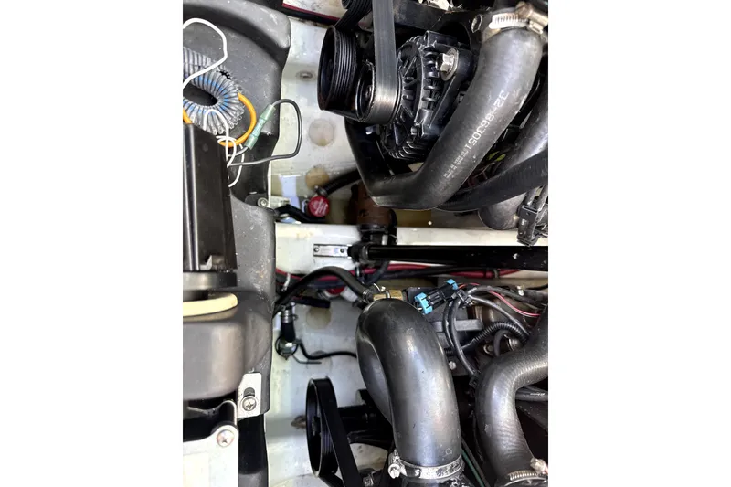 Slide: The Image of Engine compartment of a 2008 Formula 353 FASTech boat, showing hoses and wiring. - 8