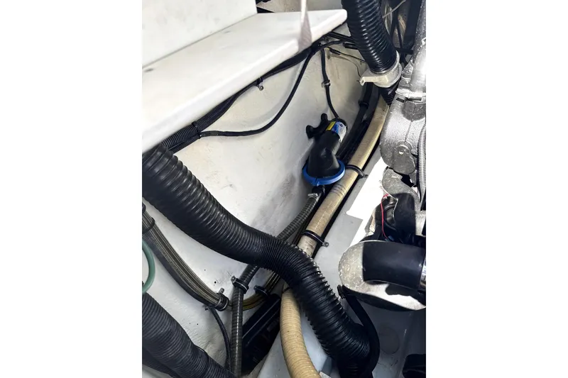 Slide: The Image of Engine compartment of a 2008 Formula 353 FASTech boat, showing hoses and components. - 9