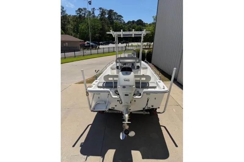 Slide: The Image of 2003 Sea Pro SV2100CC Bay Boat with outboard motor, parked outdoors. - 5