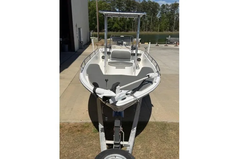 Slide: The Image of 2003 Sea Pro SV2100CC Bay Boat on trailer, parked near water. - 6