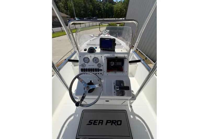 Slide: The Image of 2003 Sea Pro SV2100CC Bay Boat cockpit with steering wheel and navigation equipment. - 7