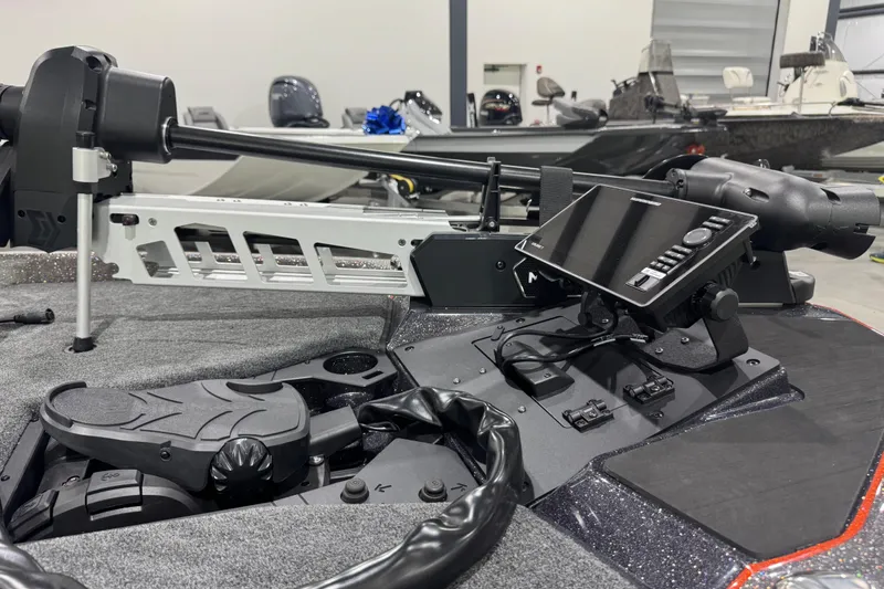 Slide: The Image of 2026 Skeeter ZXE20 boat with advanced navigation system and trolling motor in showroom. - 3