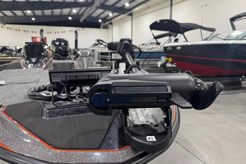 Slide: The Image of 2026 Skeeter ZXE20 boat with advanced trolling motor in showroom. - 4