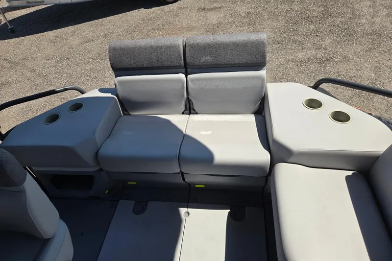 Slide: The Image of 2024 Sea-Doo Switch Cruise 18 interior seating with cup holders, gray upholstery. - 11