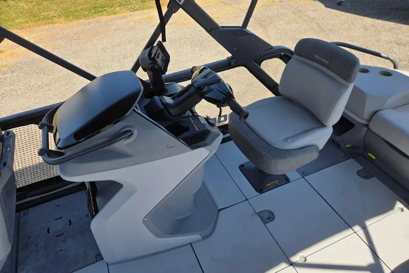 Slide: The Image of 2024 Sea-Doo Switch Cruise 18 cockpit with steering console and comfortable seating. - 12