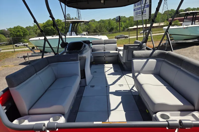 Slide: The Image of 2024 Sea-Doo Switch Cruise 18 pontoon boat interior with spacious seating and modern design. - 14