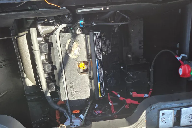 Slide: The Image of Engine compartment of 2024 Sea-Doo Switch Cruise 18, featuring Rotax engine components. - 8