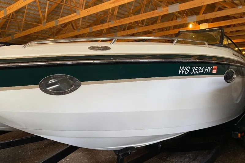 The Image of 2001 Malibu Sunscape 25 LSV boat in storage, displaying registration number WS 3534 HY. - 0